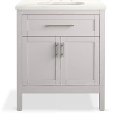 a white bathroom vanity with two doors and a sink in the middle, on a white background