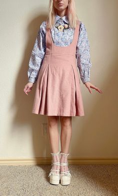 "Soft wool makes this suspender skirt a perfect winter piece. Fully lined (so you can wear with tights side zip, and buttoned straps. Back detail features gold oversized safety pins on the strap closure.  Flat measurements  Waist 13\" Overall length from shoulder 35\" Skirt length from waist 19\"" Fitted Fall Pinafore Dress With Pockets, Fitted Pinafore Dress With Adjustable Straps, Childish Outfits For Women, Overalls Skirt Outfit, 80s Skirt Outfit, Skirt Overalls Outfit, Pastel Academia Outfit, Cute Overall Dress, Pinafore Outfit