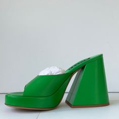 100% Goat Leather Heel Height: 12cm Made In Portugal Made In Portugal Fabric / Material 100% Goat Leather Minor Scuff On One Shoe Un-Worn Nib Green Evening Mules With Padded Heel, Modern Green Open Heel Heels, Modern Green Sandals With Branded Heel Counter, Chic Green Sandals With 4-inch Heel, Green Open Heel Mules For Evening, Evening Green Open Heel Mules, Designer High Heel Mules With Sculpted Heel, Green Open Toe Formal Mules, Green Leather Mules With Padded Heel