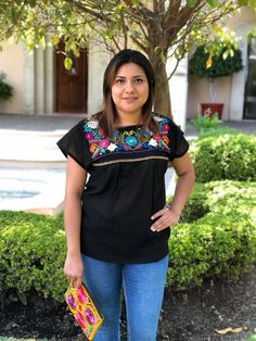 "We know there is no fiesta without the right outfit. This beautiful mexican blouse is handmade embroidered. So colorful and vibrant flowers. Will be perfect for your summer fiestas, or any boho-hippie style. Made of cotton Size: one size fits all Measurements: 17\" x 26\" This listing is for one BLACK mexican embroidered blouse All orders are shipped using Mexican Postal Service and it takes: 15-25 bussines days (North America). 20-30 bussines days (Europe). 20-35 bussines days (Rest of the wor Embroidered Fiesta Blouse, Spring Fiesta Embroidered Top With Embroidered Neckline, Multicolor Embroidered Tops For Cinco De Mayo Fiesta, Summer Fiesta Tops With Embroidered Neckline, Multicolor Embroidered Top For Fiesta, Spring Fiesta Multicolor Embroidered Top, Multicolor Embroidered Top For Spring Fiesta, Summer Fiesta Top With Geometric Embroidery, Fiesta Tops With Floral Embroidery