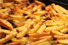 close up view of french fries with seasoning on them