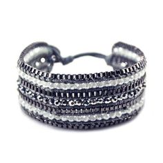 The intricate weaving of this shiny bracelet is like nothing you've seen before. Inspired on the juxtaposition of the bling and the matte, this piece is the ideal hippie chic yet classy weekend look.Bracelet Details: Chic metallic button closure Adjustable with two size options Hippie Size & Fit:L x W: 8 x 1 Trendy Woven Braided Bracelet, Trendy Woven Jewelry For Festivals, Trendy Adjustable Metal Bracelets, Trendy Metal Beaded Bracelets, Trendy Adjustable Silver Friendship Bracelets, Trendy Woven Bracelet Jewelry, Trendy Silver Metal Beaded Bracelets, Adjustable Metal Bracelets For Parties, Adjustable Metal Bracelets For Party