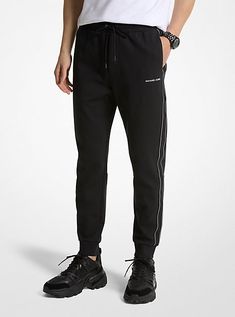 Upgrade your workout wardrobe with joggers that deliver both style and comfort. Finished with logo taping on the sides, they’re fitted with back welt and side pockets for storing on-the-go essentials like your keys and wallet. Wear them to go from lounging at home to running laps around the block. Black Joggers With Logo Waistband For Streetwear, Sporty Black Sweatpants With Logo Waistband, Black Sporty Sweatpants With Logo Waistband, Sporty Joggers With Logo Waistband For Streetwear, Casual Joggers With Logo Waistband For Sports, Sporty Sweatpants With Logo Waistband For Jogging, Sporty Sweatpants With Logo Waistband, Athleisure Sweatpants With Logo Waistband For Jogging, Sporty Sweatpants With Logo Waistband For Sports