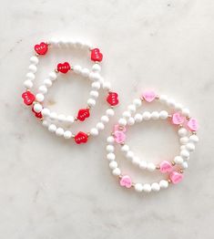 I ❤️ LOVE! The sweetest candy heart bead bracelets. Choose between pink or red hearts. Or a mix! All pieces include 14k gold or silver plating. All bracelets are FINAL SALE as these are custom orders. Please double check your bracelet size and consider the additional ½ inch increase for optimal comfort fit. CARE INSTRUCTIONS: -Avoid contact with water to improve longevity. -Roll bracelets onto your wrist to avoid over stretching. -If you are ordering a piece for a child, ALWAYS supervise while w Cute Beaded Bracelets For Valentine's Day Friendship, Cute Beaded Bracelets For Valentine's Day, Playful Pink Name Bracelet As Gift, Hypoallergenic White Jewelry For Best Friend, Cute Customizable Bracelets For Birthday Gift, Customizable Cute Beaded Bracelets For Birthday, Cute Name Bracelet For Valentine's Day Gift, Cute Personalized Stretch Bracelet As Gift, Personalized Cute Stretch Bracelet As Gift