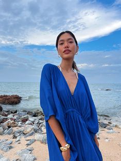 Vacation Wear Edit Blue Bohemian Dress For Pool, Blue V-neck Maxi Dress For Poolside, Blue Breezy Flowy Cover-up, Blue Flowy Breezy Cover-up, Chic Blue V-neck Cover-up, Blue Tunic Cover-up For Spring, Breezy Blue Beach Dress For Day Out, Blue Kaftan For Summer Poolside, Blue Kaftan For Pool And Summer