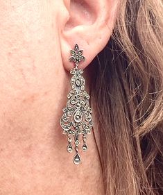 A gorgeous pair of antique sterling silver & marcasite chandelier dangle earrings. Earrings are very lovely and catch the light from all directions! From the Victorian era 1860-1880. Earrings measure 2.25 inches long x 1.7cm wide at widest point. Fully hallmarked sterling on back of earrings and push backs. No missing marcasites! Professionally cleaned and ready to wear! Antique dangle earrings are in excellent condition! Large Dangle Earrings, Silver Chandelier Earrings, Silver Chandelier, Earrings Antique, The Victorian Era, Chandelier Earrings, Victorian Era, Dangle Drop Earrings, Dangle Earrings