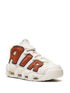 "Find NIKE Air More Uptempo \"\"basketball\"\" Sneakers on Editorialist. white/orange calf leather perforated design appliqué logo round toe front lace-up fastening double pull-tab at the opening signature Air cushioning rubber sole These styles are supplied by a premium sneaker marketplace. Stocking only the most sought-after footwear, they source and curate some of the most hard to find sneakers from around the world." Perforated Round Toe Sneakers For Streetwear, Nike Custom Sports Sneakers With Perforated Toe Box, Nike Leather Sporty Sneakers, Nike Leather Sneakers Sporty Style, Sports High-top Sneakers With Perforations Round Toe, Nike Sporty High-top Lace-up Sneakers, Sports High-top Sneakers With Perforations, Leather Low-top Basketball Shoes With Laces, White Leather Sneakers For Streetwear