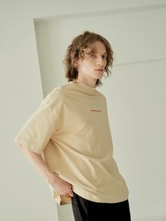 Editor's NotesOOT Basic T Shirt Beige from OUT OF TRUNK is a short sleeve T-shirt product with a loose silhouette. It has a small logo detail in the front. The neckline is a little high design.- Dropped shoulder- Neck detail- Embroidery detail- High quality stitchesMeasurements (in.)- 1- Length: 28.1 in.- Chest: 25.5 in.- Shoulder: 25.0 in.- Sleeve length: 10.8 in.Composition & Care- 100% Cotton- Dry Clean OnlyDesigner- by OUT OF TRUNK Beige Graphic Tee With Logo Print, Beige Short Sleeve T-shirt For Streetwear, Beige Cotton T-shirt With Logo Print, Beige Short Sleeve Top With Letter Print, Beige Cotton Tops With Text Print, Short Sleeve Beige T-shirt For Streetwear, Casual Beige T-shirt With Logo Print, Tan Relaxed Fit Short Sleeve T-shirt, Tan Relaxed Fit T-shirt With Short Sleeves