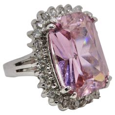 Introducing our dazzling 1990s Pink Synthetic Sapphire Silver Ring – a bold and vibrant statement piece that's perfect for those who adore the color pink. This ring combines the elegance of a synthetic sapphire with the sparkle of synthetic crystals, all encased in high-quality silver 925. This ring is all about celebrating the color pink. The synthetic sapphire at its center shines with a captivating pink hue, evoking feelings of love, passion, and femininity. The synthetic crystals surrounding Galliano Dress, Sapphire Silver Ring, Feelings Of Love, The Color Pink, Pink Handbags, John Galliano, Color Rosa, Pink Sapphire, Silver 925