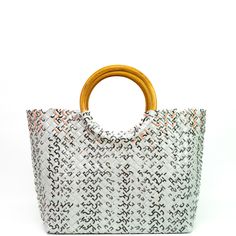 Treat the world as your personal runway with our one-of-a-kind, woven handbags made with sustainable rattan handles. Handmade from 100% upcycled materials and designed with 100% heart. *Every one of our bags are one-of-a-kind. This one you have selected (shown in first image) is 100% unique and is the exact one we'll send to you. Product Details Open top (no zipper) Soft and smooth to the touch, yet incredibly strong Double weave with 5-year warranty Handle made with sustainably sourced rattan R Trendy Beach Bag Tote With Bamboo Handle, Trendy Handwoven Top Handle Bag, Trendy Beach Bag With Round Handle, Trendy Beach Bag With Bamboo Handle, White Rectangular Straw Bag With Bamboo Handle, White Straw Bag With Bamboo Handle, White Handheld Straw Bag With Braided Handles, Trendy Tote Shoulder Bag With Bamboo Handle, Trendy Woven Straw Bag With Round Handle