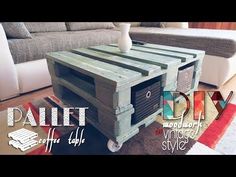 a coffee table made out of pallet wood is sitting in front of a couch