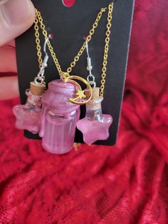 Add a touch of enchantment to your style with this charming Magic Shimmer Potion Bottle Necklace and Earring Set! This whimsical pendant features a miniature glass bottle filled with sparkling shimmer potion, capturing the essence of magic and mystery. The glass bottle is securely sealed and suspended from a dainty chain, perfect for adding a hint of mystical allure to any outfit. Whether you're a lover of fantasy or simply appreciate unique jewelry, this set is sure to bring a touch of magic to your day. Perfect for cosplay or ren faire accesories! ONE OF A KIND PIECE PLEASE NOTE I MAY NOT BE ABLE TO RECREATE THIS SPECIFIC COLOR! (If You Love it.. Get it now!) ;) Each necklace set is a handmade treasure and  truly ONE OF A KIND!  Chains (22.5" long) with easy to use clasps. 925 Sterling S Potion Bottle Earrings, Shimmer Potion, Fantasy Scrapbook, Color Changing Potion, Potion Bottle Necklace, Potion Necklace, Scented Jewelry, Magical Potion, Kawaii Cups