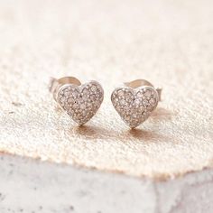 Diamond heart earrings, tiny diamond studs, real diamond heart studs simple diamond studs, bridesmaid studs, genuine diamond silver earrings_________________________________________________Tiny diamond heart shaped studs cast in silver and set with genuine diamonds by British jewellery designer Claudette Worters.  These real diamond heart earrings are a perfect gift for your wife, make great wedding earrings and make very pretty sparkling bridesmaid studs.Matching diamond necklace available here Heart Cut Diamond Earrings For Gift, Heart Cut Diamond Earrings With Prong Setting As Gift, White Gold Heart Charm Earrings For Wedding, Sterling Silver Heart Earrings With Diamond Cut, Valentine's Day Heart Cut Diamond Earrings In Sterling Silver, Delicate Sterling Silver Diamond Earrings For Anniversary, Valentine's Day Heart Earrings With Diamond Cut Cubic Zirconia, Heart Cut Diamond White Sterling Silver Earrings, Wedding White Gold Earrings With Heart Charm