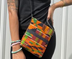 "This beautiful Kente Mini-Crossbody Bag is perfect for all your outings. It features: -42\" leather strap. Dimensions  7\"x 8\"" Multicolor Crossbody Shoulder Bag For On-the-go, Adjustable Crossbody Bags For On-the-go, Casual Crossbody Box Bag For On-the-go, Rectangular Bag With Long Strap For On-the-go, Casual Rectangular Bag Strap For Everyday Use, Multicolor Crossbody Shoulder Bag, Summer Crossbody Box Bag With Adjustable Strap, Casual Crossbody Box Bag For Everyday, Daily Use Crossbody Box Bag With Adjustable Strap