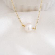 This shiny dainty pearl necklace is definitely durable for everyday wear. It is perfect on its own and also looks great for layering with other necklaces in your collection. Pearl is the birthstone for June. All items are handmade by me in my home studio. ★ D E T A I L Made from high-quality materials~ Waterproof, hypoallergenic, wear 24/7. * 925 sterling silver * 14K gold filled * Freshwater Pearl - With a 2" extender chain * W H A T  I S  14 K  G O L D - F I L L E D * Gold-filled jewelry legal Simple Pearl Drop Necklace For Gifts, Simple Pearl Chain Necklace, Delicate Everyday Pearl Necklace, Delicate Round Pearl Necklace For Everyday, Simple Pearl Clavicle Chain Necklaces, Simple Pearl Necklace With Clavicle Chain As Gift, Simple Pearl Clavicle Chain Necklace As Gift, Simple Pearl Necklace Gift, Simple Pearl Necklace For Gift