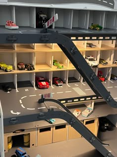 a toy car garage with cars and trucks in it