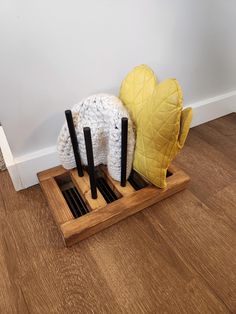 This glove or hat storage rack is the perfect way to dry your winter clothes off after a day in the snow. It sits over a floor vent and uses the heat from the house to dry off hats and gloves or mittens. There are six pegs for three pairs of gloves or two pairs of gloves and two hats. If you would like more storage, you can choose to add two pegs on each side of the rack for a total of 10 spots. The overall size is 13.5" x 8.5" x 8.75". The pegs are removable for easy storage and they can be put Mitten Storage, Glove Dryer, Diy Mittens, Floor Vent, Heat Vents, Women's Mittens, Floor Vents, Hat Storage, Snow Outfit