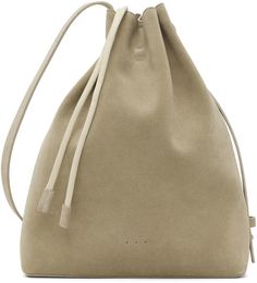 Buffed calfskin shoulder bag in beige. · Carry handle · Adjustable shoulder strap · Magnetic fastening at throat · Patch pocket at two-compartment interior · Faux-leather lining in taupe · H7.5 x W10 x D4.25 in Available exclusively at SSENSE. Supplier color: Light olive | Aesther Ekme SSENSE Exclusive Beige Mini Sac Shoulder Bag Beige Soft Leather Bucket Bag For Errands, Beige Soft Leather Crossbody Bucket Bag, Modern Neutral Leather Bag, Modern Neutral Bag With Removable Pouch, Modern Beige Bucket Bag With Dust Bag, Modern Beige Top Handle Hobo Bag, Modern Beige Leather Backpack With Removable Pouch, Chic Beige Leather Backpack For Daily Use, Beige Soft Leather Hobo Bag For On-the-go