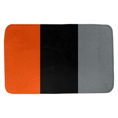 an orange, black and grey bath mat