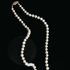 A modern take on a classic staple featuring lustrous white pearls. These luxurious pearl necklaces are hand-knotted on silk, accented with an antique 14k gold basket clasp. The necklace length makes the pearls easy to wear and layer with other pieces. Hand-strung on silk Measures approx. 17" long Finished with an antique 14k clasp Custom lengths available Because our pieces are all made entirely by hand we can offer a huge array of customization! If you have inquiries about custom sizing, stone Luxury Pearl Necklaces With Round Beads, Classic Single Strand Akoya Pearl Necklace, Classic Akoya Pearl Single Strand Necklace, Elegant Long Single Strand Pearl Necklace, Classic Single Strand Pearl Beaded Necklaces, Classic Single Strand Pearl Beaded Necklace, Classic Long Pearl Necklace With Charm, Luxury Pearl Necklace With Round Beads And Pearl Charm, Luxury Long Pearl Necklace With Charm