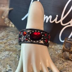 Chunky Beautiful Black Metal Lattice Style Design Hinged Bangle Bracelet . The Gemstones Are Vivid Red And Clear Resin Design . The Thickness Is 2.0 Inches Across . Well Made Metal ! Will Fit A Wrist Of 6 To 12 Inches . Elegant Red Metal Cuff Bracelet, Red Jeweled Bracelet For Party, Adjustable Red Bracelet With Rhinestones, Adjustable Red Metal Cuff Bracelet, Red Adjustable Metal Cuff Bracelet, Red Rhinestone Bracelets For Party, Red Metal Cuff Bracelet, Elegant Red Bracelets For Evening, Purple Crystal Bracelet