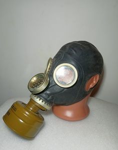 a gas mask on top of a plastic head