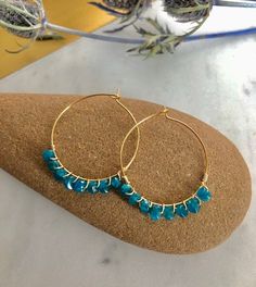 Elegant Blue Apetite Stones beaded and dangle in either choice of silver plated hoops, sterling silver hoops, gold plated hoops, or 14k gold filled hoops. Perfect bohemian jewelry, perfect size and dangle. Super gorgeous with boho outfits. Light and comfortable. Make a statement today! 💜Simple, Dainty and Elegant Raw Natural Stones for everyday wear that's lasting. Simple yet elegant especially the shine and color are so gorgeous.The picture does not do it justice it and is much prettier in per Gemstone Beads Hoop Earrings Gift, Bohemian Hoop Earrings With Natural Stones, Bohemian Wire Wrapped Hoop Earrings For Everyday, Adjustable Bohemian Gemstone Hoop Earrings, Bohemian Wire Wrapped Hoop Earrings, Blue Bohemian Hoop Earrings With Natural Stones, Bohemian Blue Hoop Earrings With Natural Stones, Everyday Bohemian Wire Wrapped Hoop Earrings, Blue Bohemian Hoop Earrings For Everyday