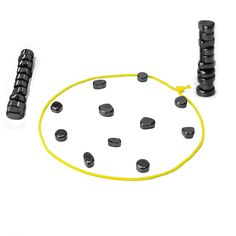 an assortment of black and yellow objects on a white surface, including two large plastic discs