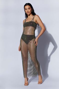 DELARA brings the romance of a night-time seascape, wherever you are. She’ll help you light up the room as soon as you enter, with rhinestones, soft mesh, and a unique cut. Beneath the sheet of glittering fabric, she’s simple — but suggestive. The bandeau and undie combination leave very little to the imagination, but the rich, translucent material covering balances it out with a layer of allure. Soft nylon and elastic lining keeps the bodice moulding to your shape while the loose, polyester ski Pool Party Attire, Translucent Material, Pool Party Outfits, Vegas Outfit, Mesh Maxi Dress, Chiffon Mini Dress, Sin City, Chiffon Long Sleeve, Date Night Dresses