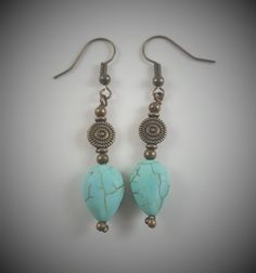 These earrings are handcrafted with bronze colored copper wire and artificial turquoise beads.  The earrings measure approximately 1 ½" from the top of the earring to the bottom.  This measurement does not include the ear hooks. Colors may appear different than they actually are depending on your monitor color settings and the lighting used during photography. Every item I create is made with great care and attention to detail; however as with all handmade items, there may be small imperfections in each item, but I like to refer to them as "added interest".  I would like to take this moment to thank you all for allowing me to share my craft! Turquoise Beaded Earrings With Metal Ear Wire, Handmade Turquoise Beaded Metal Earrings, Handmade Turquoise Beaded Earrings, Adjustable Turquoise Beaded Copper Earrings, Turquoise Wire Wrapped Copper Earrings, Handmade Turquoise Earrings With Copper Wire, Turquoise Beaded Copper Earrings, Earrings Artificial, Copper Wire Earrings