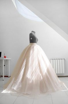 a mannequin is standing in front of a dress