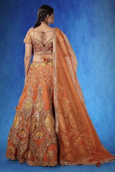 A gorgeous lehenga adorned with intricate aari and foil work, complemented by cutdana embellishments. This orange organza outfit is a perfect blend of tradition and modern elegance. WASH CARE INSTRUCTIONS - Please Dry clean only when it is applicable! Ready to Ship! Dark Orange Lehenga, Festive Orange Lehenga With Dabka Detailing, Luxury Orange Organza Lehenga, Orange Resham Embroidery Lehenga, Unstitched Orange Lehenga With Cutdana, Organza Outfit, Gorgeous Lehenga, Bridal Lehenga, Wedding Looks