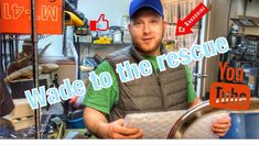 a man in a blue hat is holding a metal tray with words on it that read wade to the rescue you tube