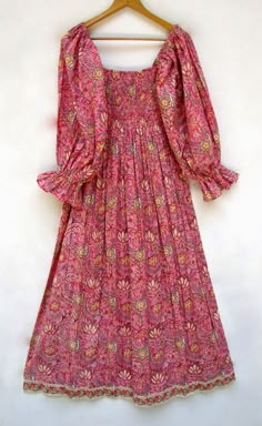 "ITEM DESCRIPTION pink lily's trendy flower printed cotton long maxi dress - square neckline with smocked boho maxi dress - long sleeve maxi dress Features: Long sleeve, square neck, Long dress Material: Cotton cambric Fabric: 100% cotton soft light weight ethnic print fabrics  Sleeve Length = 22 inch For more sizes & their measurement, please refer our below chart to understand the sizes variations available with us For your size requirement, please mention your size in seller note at the time of buying. SIZE MEASUREMENT  BUSTLENGTHSHOULDER XXS34 inch51 inch13.5 inch XS36 inch51 inch14 inch S38 inch51 inch14.5 inch M40 inch51 inch15 inch L42 inch51 inch16 inch XL44 inch51 inch16.5 inch 2XL46 inch51 inch17 inch 3XL48 inch51 inch18 inch   Company Return Policy:  Please write for more inform Summer Maxi Dress With Gathered Bishop Sleeves, Pink Bohemian Dress With Gathered Sleeves, Bohemian Flowy Maxi Dress With Smocked Cuffs, Flowy Bohemian Maxi Dress With Smocked Cuffs, Pink Summer Maxi Dress With Gathered Sleeves, Pink Maxi Dress With Gathered Sleeves For Summer, Bohemian Smocked Maxi Dress With Cuffs, Bohemian Smocked Maxi Dress With Smocked Cuffs, Bohemian Maxi Smocked Dress With Smocked Cuffs