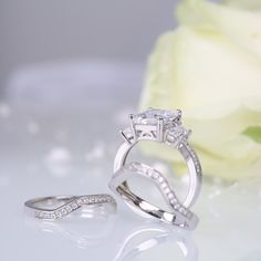 This three piece ring set shimmers with all your beautiful moments to come. It showcases a radiant cut center stone flanked by baguette cut stones, while additional round stones line the shank. On your special day, two coordinating wedding bands fit closely with the engagement ring to complete this fabulous ensemble. All the stones sparkle perfectly from every angle,making the ring an eye-catcher everywhere. Carat Weight: 5.2 ctStone Size: 8*10 mmStone Type: Jeulia® StoneNumber of Stones: 1 Stone Color: Diamond WhiteStone Shape: RadiantCarat Weight: 1.085 ctStone Size: 6*5*3,1.2,1.5 mmStone Type: Jeulia® StoneNumber of Stones: 58 Stone Color: Diamond WhiteStone Shape: Tapered Baguette, RoundWeight: 9.24 gWidth: 14.33 mmHeight: 5.66 mmThickness: 6.95 mmMaterial: 925 SilverPlating Color: Sil Jeulia Jewelry, Sterling Silver Rings Set, Silver Ring Set, Radiant Cut, Bridal Sets, Beautiful Moments, Quality Jewelry, Ring Set, Sterling Silver Ring