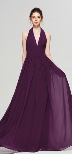 a woman in a long purple dress