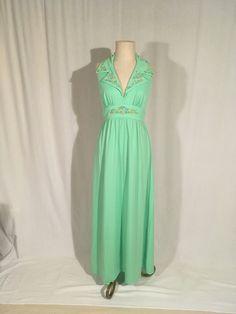 "1970s handmade dress sherbet green polyester rainbow ric rac trim wide high waist band big double breast collar back neck hook eyes zip up back waist straps from back collar down back plunge sleeveless arm pit full length good vintage condition, light wear measures, lying flat, bust at fullest-19\" waist band-14 1/2\" top to waist band at center top-12 1/2\" hip-free total length-60\" (5')" Fitted Green Maxi Dress With Empire Waist, Vintage Green Maxi Dress For Summer, Green Vintage Maxi Dress For Summer, Vintage Green V-neck Maxi Dress, 1970s Style Summer Floor-length Dresses, Green Vintage V-neck Maxi Dress, 1970s Style Floor-length Summer Dresses, 1970s Fitted Sleeveless Maxi Dress, 1970s Fitted Green Maxi Dress