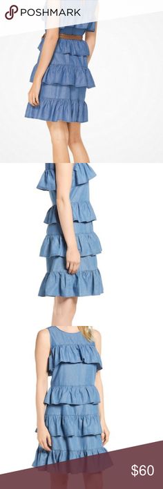 MICHAEL MICHAEL KORS Ruffled Chambray Dress MICHAEL MICHAEL KORS RUFFLED CHAMBRAY DRESS This soft chambray, this dress strikes a casual yet playful mood in a relaxed silhouette detailed with ruffled tiers. can be worn with  a  belt and accessorized with a straw tote for a laid-back look. 57% Cotton/43% Lyocell, HAND WASH, TUMBLE DRY,BACK KEYHOLE BUTTON-LOOP CLOSURE Michael Kors Dresses Fitted Knee-length Tiered Spring Dress, Casual Fitted Blue Tiered Dress, Sleeveless Michael Kors Summer Dresses, Michael Kors Sleeveless Summer Dresses, Michael Kors Fitted Dresses For Spring, Michael Kors Fitted Spring Dresses, Fitted Michael Kors Dress For Spring, Michael Kors Fitted Casual Dress, Casual Fitted Michael Kors Dress