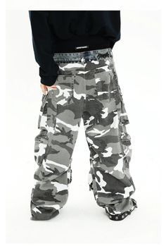 The Urban Camouflage Cargo Pants combine a modern camouflage print with a functional cargo design, perfect for adding a rugged and stylish edge to your wardrobe. Made from durable, high-quality fabric, these pants ensure comfort and longevity. The multiple cargo pockets provide ample storage and practicality, while the relaxed fit offers ease of movement. Fabric Information: 100% Pure Cotton Model's measurements: Height 180cm, Weight 65kg, wearing size L. Military Style Cargo Jeans With Multiple Pockets For Streetwear, Military Style Cargo Bottoms For Streetwear, Baggy Combat Cargo Pants With Multiple Pockets, Camouflage Cotton Bottoms With Cargo Pockets, Combat Cargo Pants With Multiple Pockets And Baggy Fit, Baggy Military Cargo Jeans For Streetwear, Military Style Cargo Pants With Multiple Pockets For Streetwear, Military Style Baggy Cargo Jeans For Streetwear, Camouflage Cargo Jeans For Streetwear