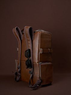 Rectangular Everyday Backpack, Rectangular Leather-backed Everyday Backpack, Rectangular Leather-backed Backpack For Everyday Carry, Rectangular Backpack With Leather Backing For Everyday Carry, Leather Bag With Adjustable Straps For Daily Use, Leather Rectangular Backpack With Adjustable Straps, Rectangular Luggage With Detachable Strap For Trips, Luxury Daily Use Bags With Adjustable Straps, Modern Leather Bags With Adjustable Straps