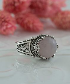 Rose Quartz Silver Victorian Filigree Ring, 925 Sterling Silver Artisan Made Gothic Goth Women Statement Cocktail Ring Silver boho ring, pink quartz wedding, anniversary gift, rose quartz jewelry, round cut quartz, crystal quartz ring, pink gemstone ring Gemstone: Rose Quartz 10mm. Material: 925 Sterling Silver ( NICKEL FREE ) This artisan crafted statement ring piece that's sure to turn heads. Add some coolness to your ensemble with our Crystal Quartz silver gothic filigree ring FREE, FAST AND Pink Moonstone Sterling Silver Ring For Anniversary, Pink Sterling Silver Moonstone Promise Ring, Pink Sterling Silver Spiritual Rings, Handmade Pink Crystal Ring For Anniversary, Elegant Handmade Pink Crystal Ring, Pink Spiritual Rings For Anniversary, Spiritual Pink Rings For Anniversary, Bohemian Pink Rings For Anniversary, Bohemian Pink Ring For Anniversary