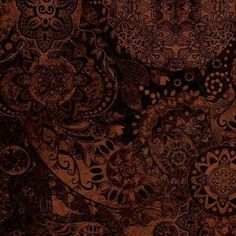 an intricately designed wallpaper with brown and black designs on the backgrund