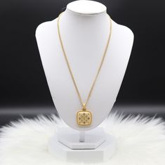 An elegant gold necklace featuring a sparkling pendant, exuding timeless sophistication with its gleaming design. The interplay of the lustrous gold chain and the sparkling pendant creates a refined and glamorous accessory suitable for various occasions. Length: 20” Closure: Lobster Claw Clover Pendant: 1.41” (Length) 1.02” (Width) Material: Brass with 18K Gold Plating and Rhodium Coating Lead Free and Hypoallergenic Gold Plated Rhinestone Necklace With Adjustable Chain, Elegant Gold Diamond Necklace With Gold Chain, Gold-tone Locket Chain Necklace As Gift, Gold-tone Chain Necklace With Locket For Gift, Gold Luxury Rhinestone Necklace For Formal Occasions, Luxury Gold Rhinestone Necklace For Formal Occasions, Gold-plated Rhinestone Necklace With Adjustable Chain, Elegant Gold-tone Medallion Necklace With Gold Chain, Gold-plated Locket Necklace With Adjustable Chain