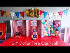 a red table topped with lots of balloons next to a sign that says diy dollar tree carnival