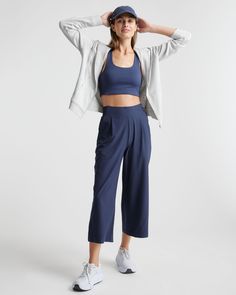 These look like classic work pants, but move like your favorite activewear. Our cropped Performance Tech Wide Leg Commuter Pants have just the right amount of stretch for days when you’re on the go, plus the sun protection and quick-dry properties of top-notch performance wear. And they look great with sneakers.  | Quince | Women's Performance Tech Wide Leg Pants in Navy, Size XS, Recycled Polyester Wide Leg Activewear With Pockets And 4-way Stretch, Relaxed Fit Athleisure Elastane Pants, Stretch Wide-leg Athleisure Joggers, Functional Activewear With 4-way Stretch, Sporty Ankle-length Elastane Pants, Casual Straight Pants Activewear For Workout, Athleisure Elastane Pants With Pockets, Athleisure Pants With Pockets, Casual Wide Leg Activewear For Workout