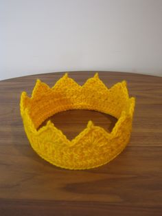 The Everyday Crown is a handmade unisex crochet crown made for all purposes:  festivals, birthdays, dress up, Halloween costumes, and random Tuesdays when the people in your life need a reminder of how royal you are!  This made-to-order item can be made in adult or childrens' sizes, and features a decoratively stitched base, sunray points (7 for adult sizes, 5 or 6 for childrens' sizes).  This coronet is made with a bright gold acrylic yarn that is stiff enough to hold the royal shape, but soft enough for comfort.  Conveniently, this diadem can be folded and put in your pocket for when you need to duck the paparazzi.  Also machine washable because...life. This forms a great base to further glamorize by adding various jewels and sparkles available at your favorite craft or bead store. Other Birthdays Dress, Unisex Crochet, Dress Up Halloween, Up Halloween Costumes, Crochet Crown, Up Halloween, Bead Store, Bright Gold, Adult Costumes