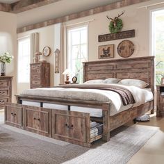 a bedroom with a bed, dressers and other furniture in it's center