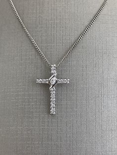 14 Karat White Gold Medium Size Cross with Diamonds and Chain For Her 18 inch chain length 2.8 grams Cheap White Cross Jewelry, Luxury White Cross Necklace Elegant Style, Luxury Classic Diamond White Cross Necklace, Luxury Brilliant Cut Diamond White Cross Necklace, Elegant Cross Chain Necklace With Adjustable Chain, Elegant Sterling Silver Cross Chain Necklace, Elegant Cross Chain Necklace With Silver Chain, White Gold Necklace With Cross Pendant, Elegant Silver Chain Necklace With Cross Pendant