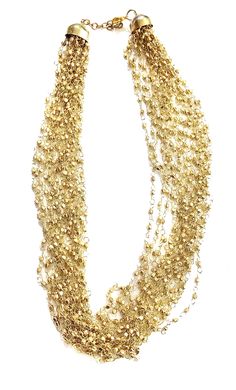 "Layered GOLD Beaded necklace perfect for the upcoming holiday parties ** Multi strand fine beaded Necklace ** hand beaded jewelry ** Length of Necklace is 18 inches ** Perfect on a Little Black Dress or even a T-shirt. ** Make a statement this thanksgiving or be the spice of the Christmas party. This beautiful necklace would make a great Holiday Gift for someone special. All Items come carefully gift wrapped in branded boxes or bags. A complimentary message can be included on request. PRESS: \" Beaded Layered Necklace For Party With Round Beads, Beaded Layered Necklace With Round Beads For Party, Beaded Layered Necklace For Party, Party Layered Necklace With Beaded Chain, Party Jewelry In Gold-tone With Gold Beads, Gold Necklace For Party And Holiday, Multi-strand Gold Jewelry For Celebration, Gold Layered Necklace With Round Beads, Gold Jewelry For Holiday Party