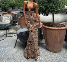 This summer, elevate your wardrobe with this stunning Lace Leopard Print Maxi Dress. Made with high-quality polyester fabric, this dress has a slight stretch for comfortable wear. The regular fit and straight silhouette flatter your figure, while the deep V-neckline and backless design add a touch of sensuality. The delicate lace detailing and ankle-length hemline bring a touch of elegance to this sexy and chic dress. Perfect for any occasion, this dress will surely turn heads and leave a lasting impression. Don't miss out on adding this dress to your collection - order now before it's gone! Leopard Print Maxi Dress, Backless Design, Summer Knitting, Mini Dresses Summer, Style Maxi Dress, Printed Maxi, Mini Dress With Sleeves, 50's Dress, Chic Dress